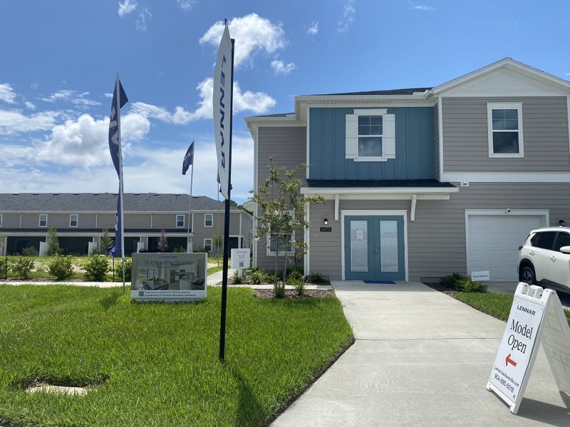 A contemporary townhouse with a manicured lawn in Mill Creek North Townhomes by Lennar, Jacksonville, FL.