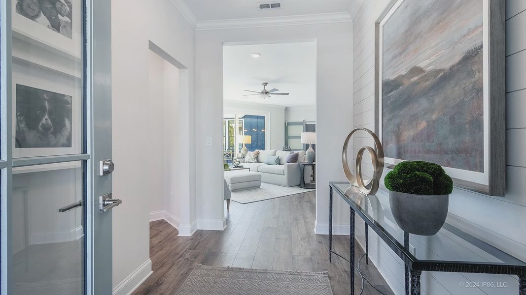 Furnished interior in a model home at The Courtyards at Redbud Lane in Holly Springs (Image 25).