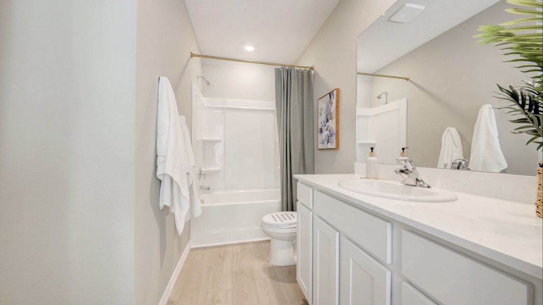 Furnished interior in a model home at The Gardens at Bay Street in Sarasota (Image 24).