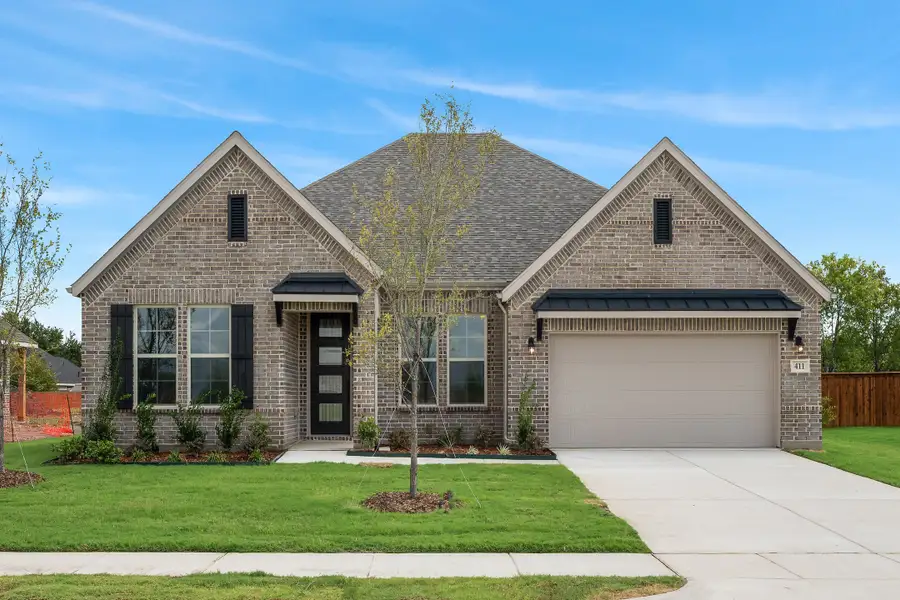 Front exterior of a home in the Heath Golf and Yacht Club community, located in Heath, TX (Image 4).