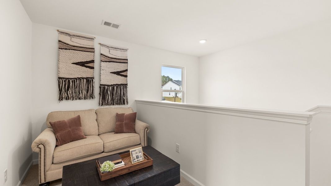 Furnished interior in a model home at Oakchase at Hampton in Hampton (Image 23).