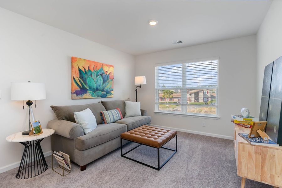 Furnished interior in a model home at Island Green in Myrtle Beach (Image 38).
