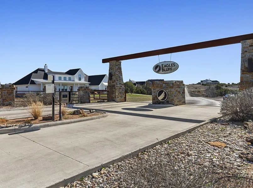 Entrance to the Eagles Bluff community in Weatherford, TX, featuring signage and landscaping (Image 1).