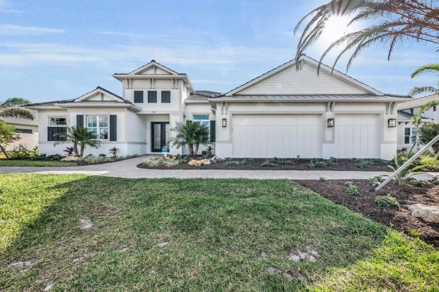 Front exterior of a home in the Artisan at Watercolor Place community, located in Bradenton, FL (Image 58).