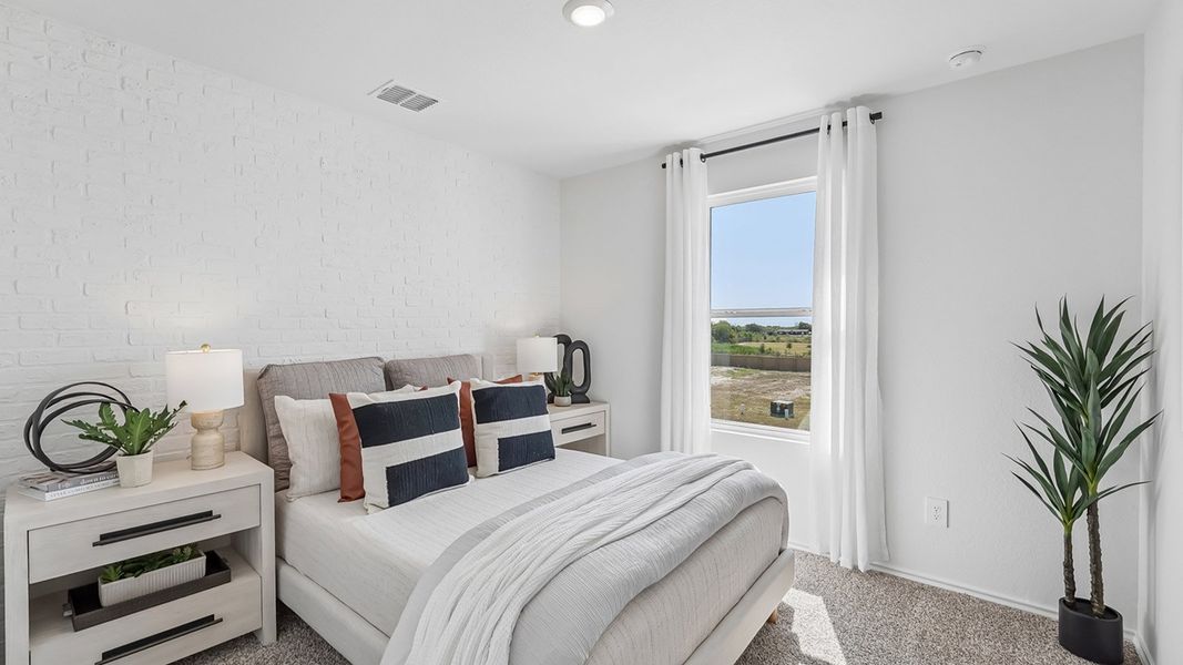 Furnished interior in a model home at Marigold in Kyle (Image 27).