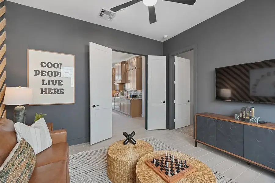 Furnished interior in a model home at Brookewater 60's in Rosenberg (Image 9).