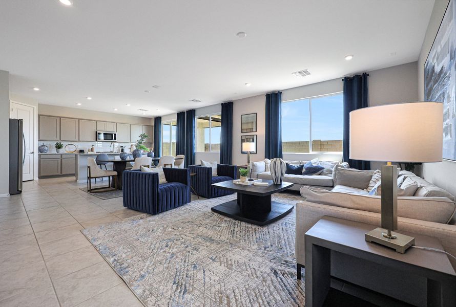 A living room with a large window. A living room with a large window.