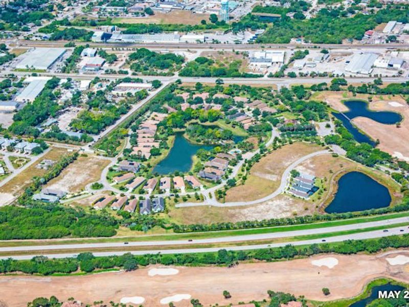 Aerial view of the The Falls at Grand Harbor community in Vero Beach, FL, showing layout and nearby surroundings (Image 20).