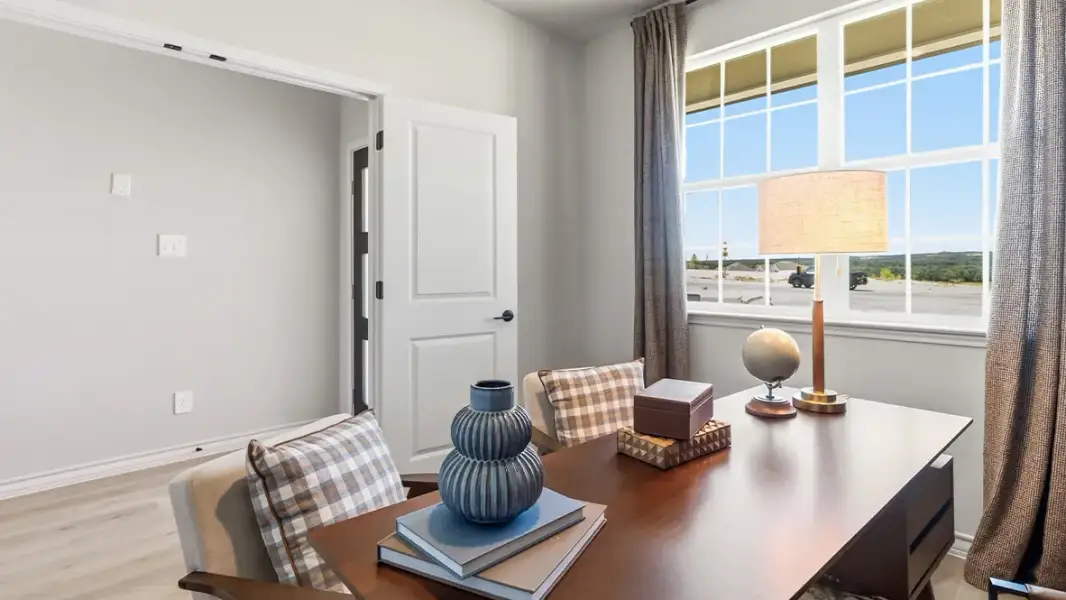 Furnished interior in a model home at The Woodlands at Medina Hills in Mico (Image 6).
