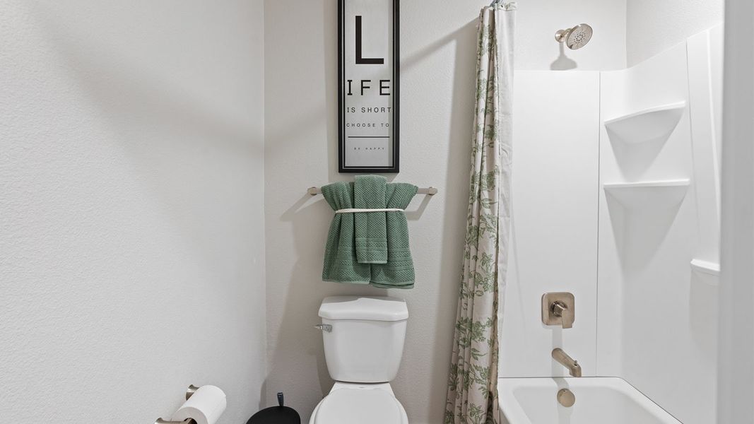 Furnished interior in a model home at King's Landing in Corpus Christi (Image 13).