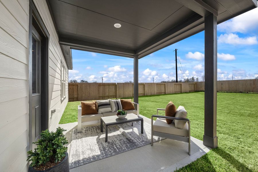 A deck with a table and chairs and a large window with a view of a field and a. A deck with a table and chairs and a large window with a view of a field and a.