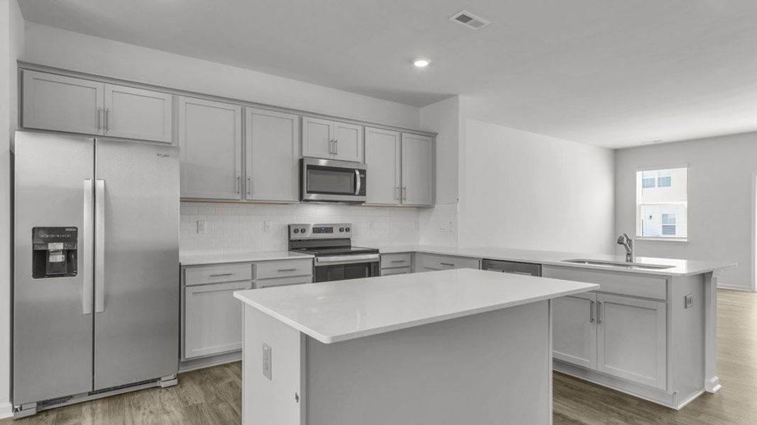 Furnished interior in a model home at The Townes at Madden West in Fuquay Varina (Image 8).