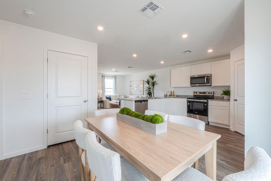 A kitchen with white cabinets. A kitchen with white cabinets.