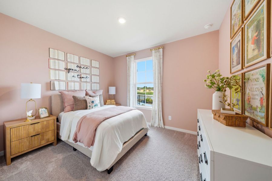 A bedroom with a bed and a window.