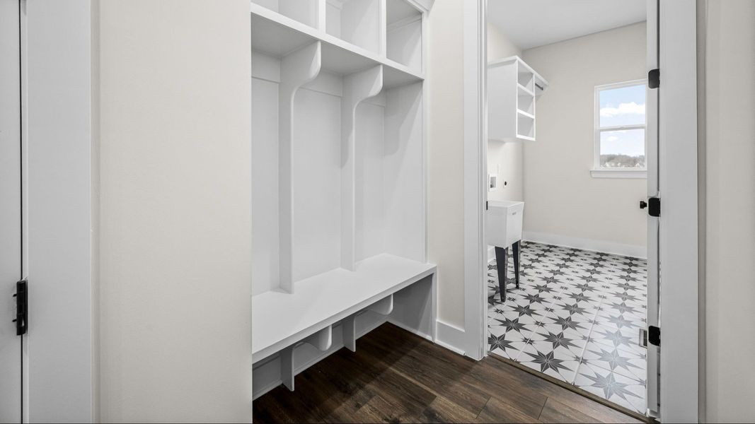 Beautiful Drop-zone and dedicated laundry room including specialty floor, window, and sink. Beautiful Drop-zone and dedicated laundry room including specialty floor, window, and sink.