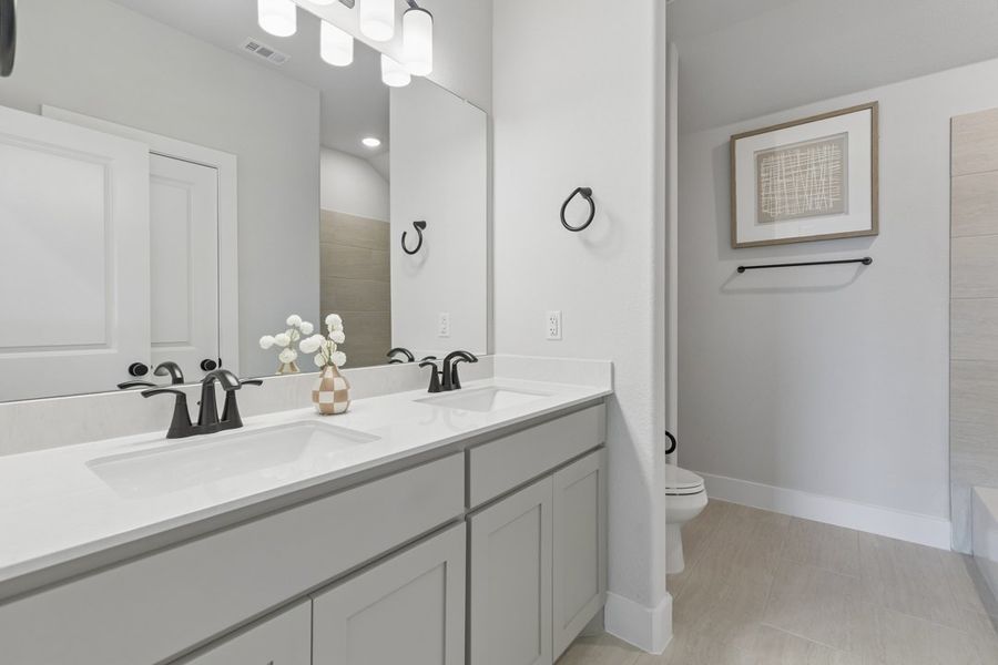 Furnished interior in a model home at Ten Mile Creek in DeSoto (Image 21).