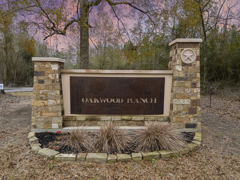 A sign on a stone wall. A sign on a stone wall.