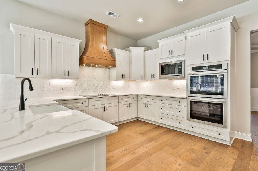 Furnished interior in a model home at Welch Farms in Senoia (Image 6).