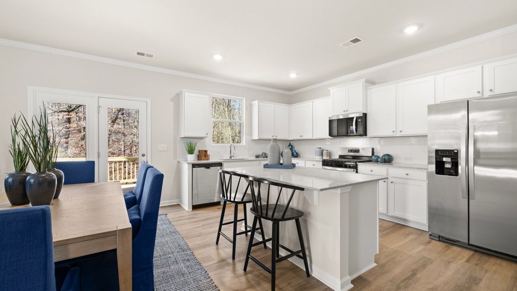 Furnished interior in a model home at Liberty Crossing in Braselton (Image 7).