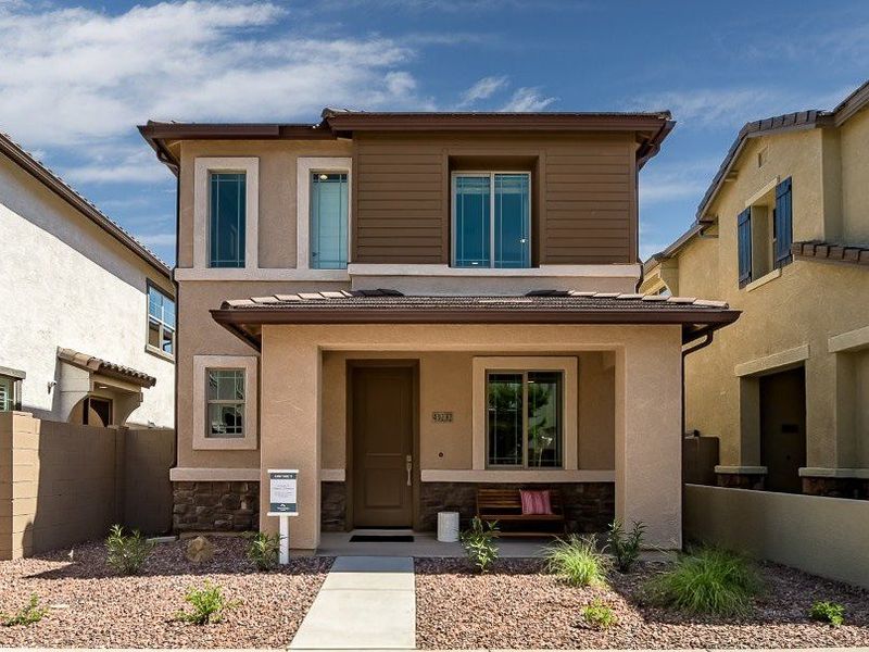 Front exterior of a home in the Ironwood Villages at North Creek community, located in Queen Creek, AZ (Image 3).