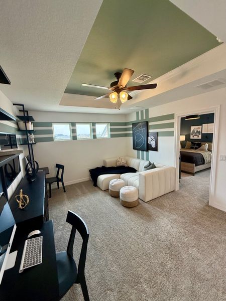 A cozy home office with a stylish desk, comfortable seating, and modern decor. Neutral tones create a serene workspace.