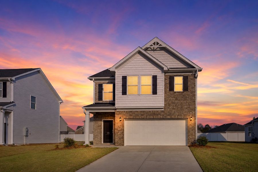 Front exterior of a home in the The Grove community, located in Florence, SC (Image 2). Front exterior of a home in the The Grove community, located in Florence, SC (Image 2).