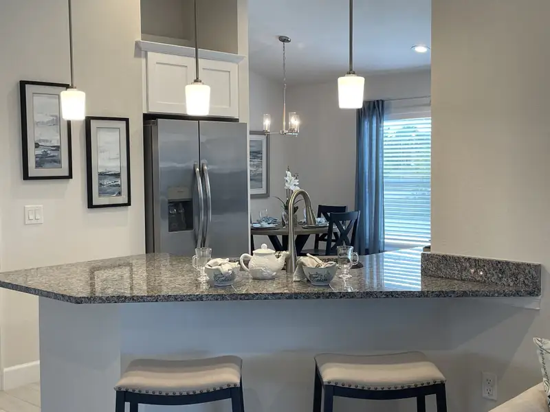Furnished interior in a model home at Watercress Cove in North Port (Image 3).
