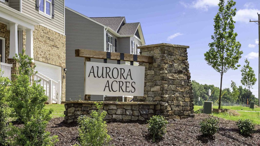 Entrance to the Aurora Acres community in Snow Camp, NC, featuring signage and landscaping (Image 11).