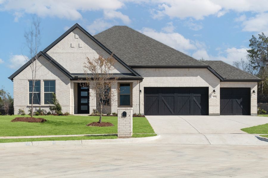 Front exterior of a home in the Heath Golf and Yacht Club community, located in Heath, TX (Image 4).
