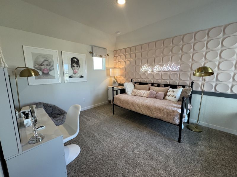 A chic bedroom with playful bubblegum art, textured wall panels, and a cozy daybed. Modern desk and stylish floor lamps. A chic bedroom with playful bubblegum art, textured wall panels, and a cozy daybed. Modern desk and stylish floor lamps.