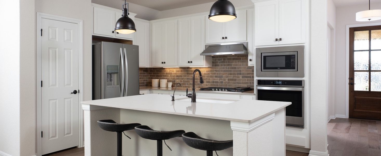 Furnished interior in a model home at Berry Creek Highlands in Georgetown (Image 14).