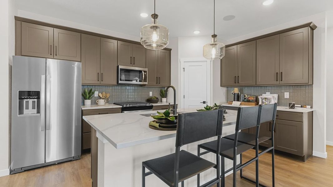 Experience modern elegance with quartz countertops, sophisticated cabinetry, and upscale finishes at Timnath Lakes. Experience modern elegance with quartz countertops, sophisticated cabinetry, and upscale finishes at Timnath Lakes.