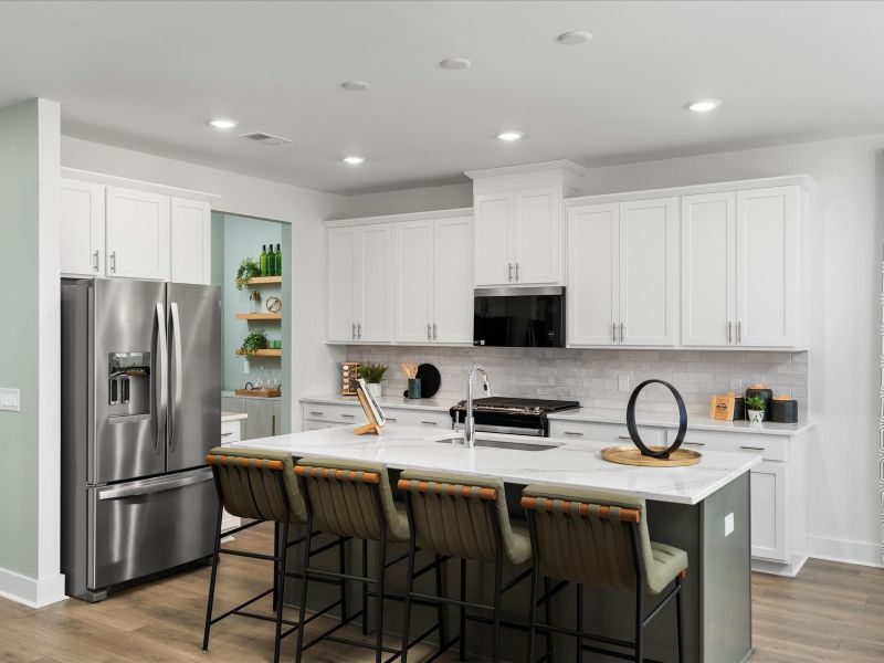 The well-appointed kitchen features a large island to make meal prep a breeze.