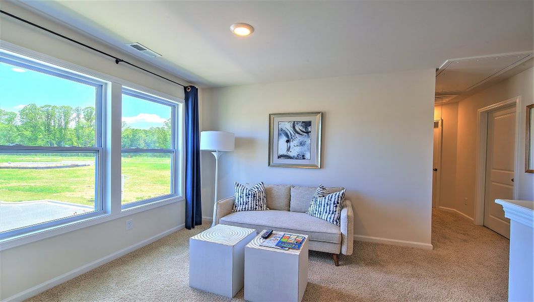 Furnished interior in a model home at Townes at Tap Root Farms in Fletcher (Image 25).