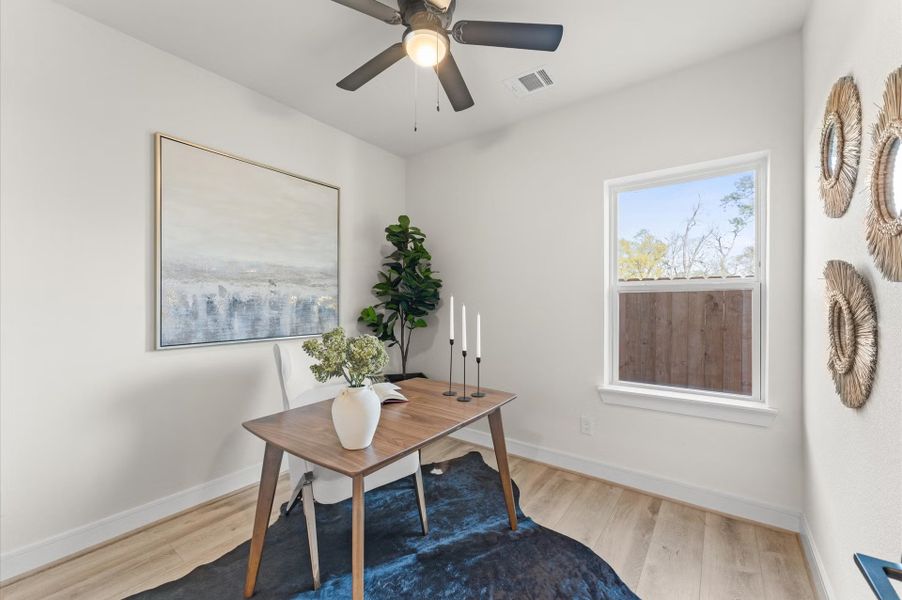 Furnished interior in a model home at Highland Gardens in Houston (Image 28).