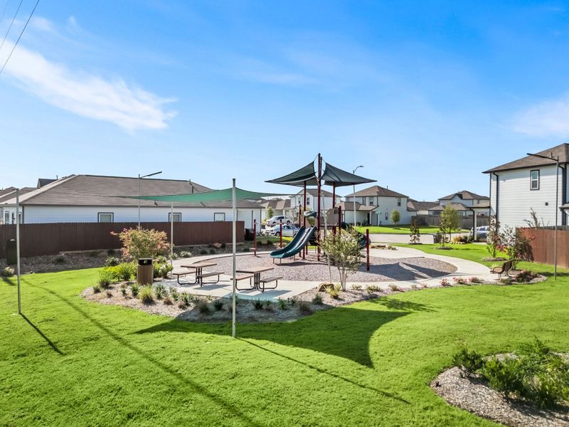 A backyard with a slide and a slide. A backyard with a slide and a slide.