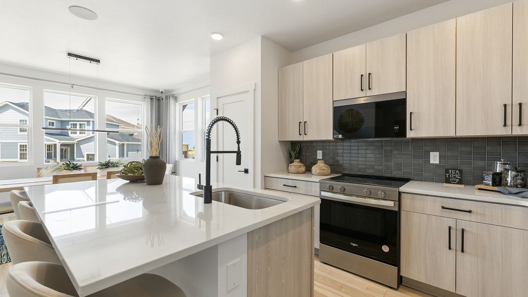 Luxurious modern kitchen showcases sleek residential design and elegant architectural details.