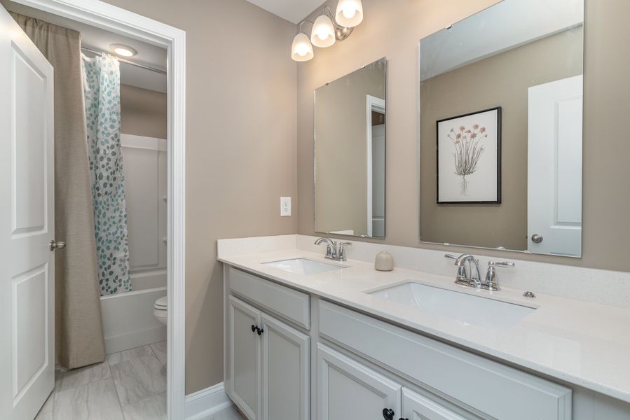 Furnished interior in a model home at Waterbridge in Myrtle Beach (Image 53).