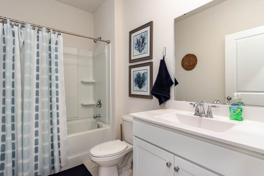Furnished interior in a model home at Island Green in Myrtle Beach (Image 51).