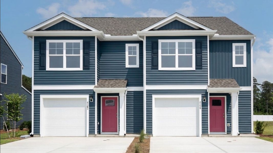 Front exterior of a home in the Townes at Seabrooke community, located in Leland, NC (Image 4).