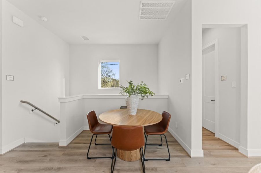 Furnished interior in a model home at Highland Gardens in Houston (Image 22).