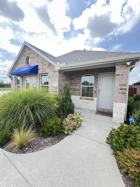 Charming brick home with lush landscaping in Elevon by D.R. Horton (Lavon, TX). Charming brick home with lush landscaping in Elevon by D.R. Horton (Lavon, TX).