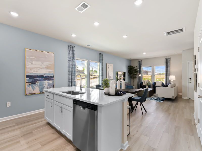 A large kitchen island overlooks the sprawling great room, perfect for entertaining.
