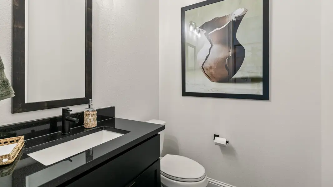 Furnished interior in a model home at Creekhaven in Iowa Colony (Image 5).