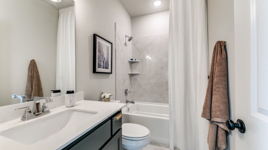 Furnished interior in a model home at Estates at Stacy Crossing in McKinney (Image 41).