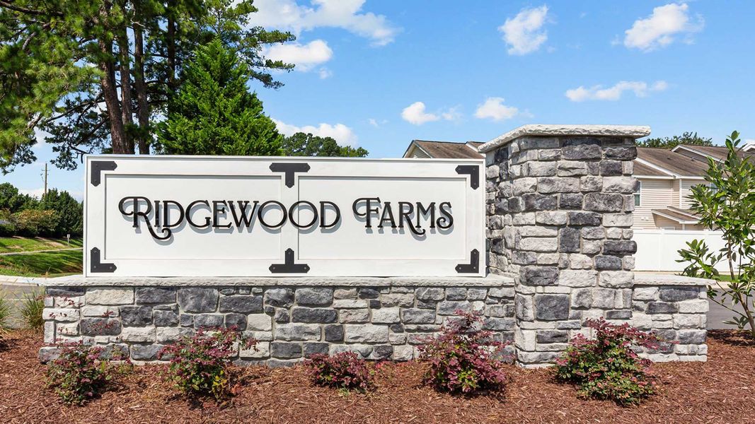 Entrance to the The Townes at Ridgewood Farms community in Winterville, NC, featuring signage and landscaping (Image 2).