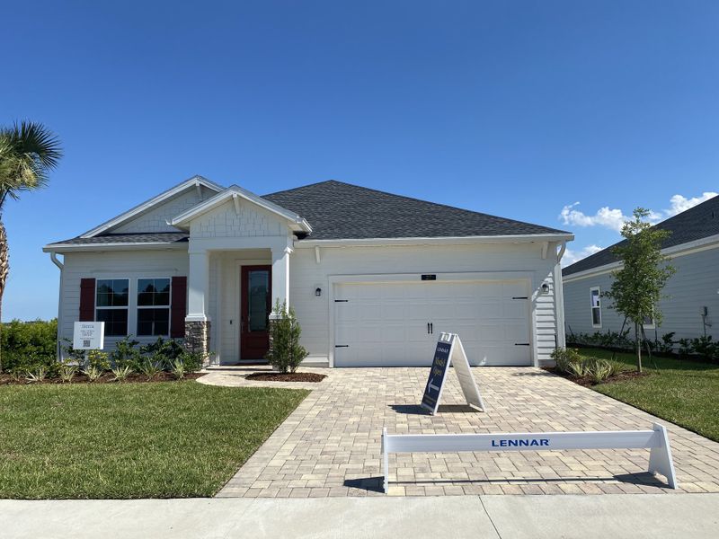 A charming white home with red shutters and a manicured lawn in SilverLeaf: Silver Meadows 60s by Lennar (St. Augustine, FL). A charming white home with red shutters and a manicured lawn in SilverLeaf: Silver Meadows 60s by Lennar (St. Augustine, FL).