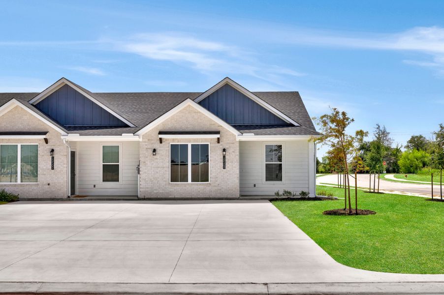 Front exterior of a home in the Townhomes at Yaupon Trails community, located in Bryan, TX (Image 5).