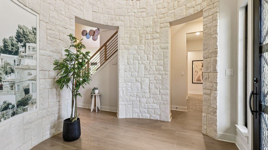 Stunning stonework and exquisite flooring elevate this Verandas at the Rim foyer to unmatched luxury. Stunning stonework and exquisite flooring elevate this Verandas at the Rim foyer to unmatched luxury.