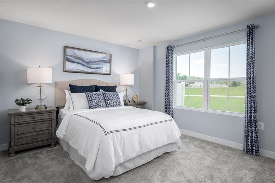 Furnished interior in a model home at Lakes at Riverbend Townhomes in Navassa (Image 6).
